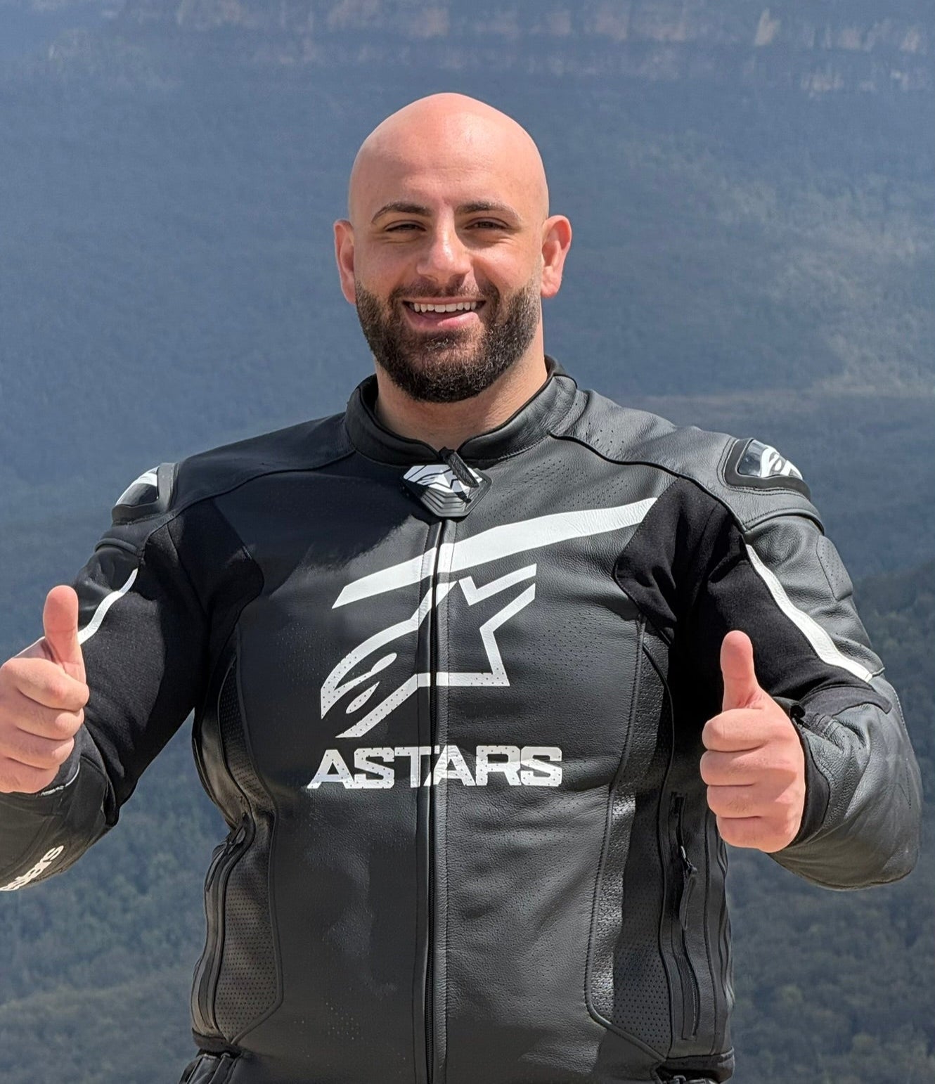 Owner of Jerkin’ It jerky throwing two thumbs up with a cheeky grin